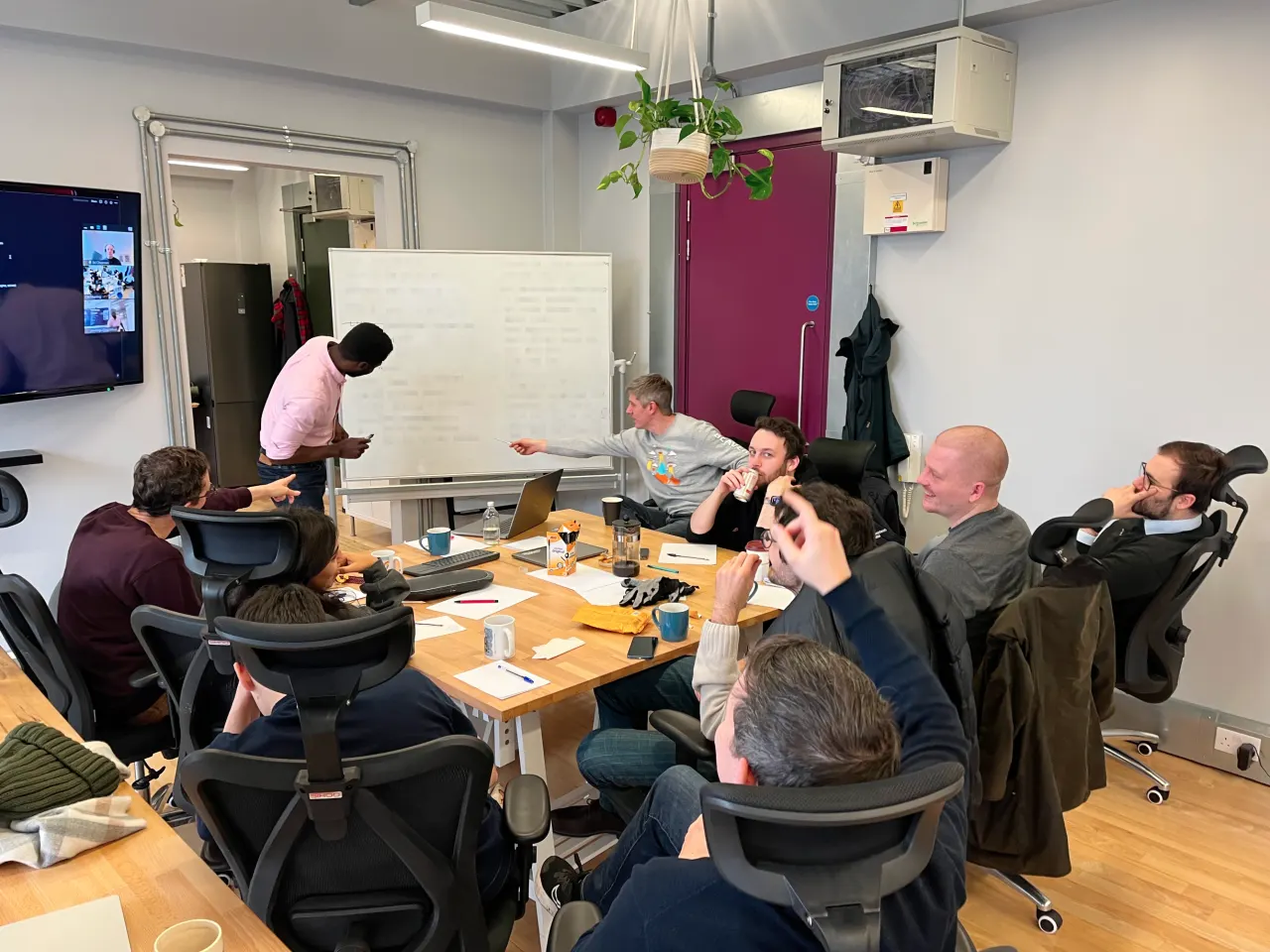 The Circuit Mind team working through a problem at the whiteboard