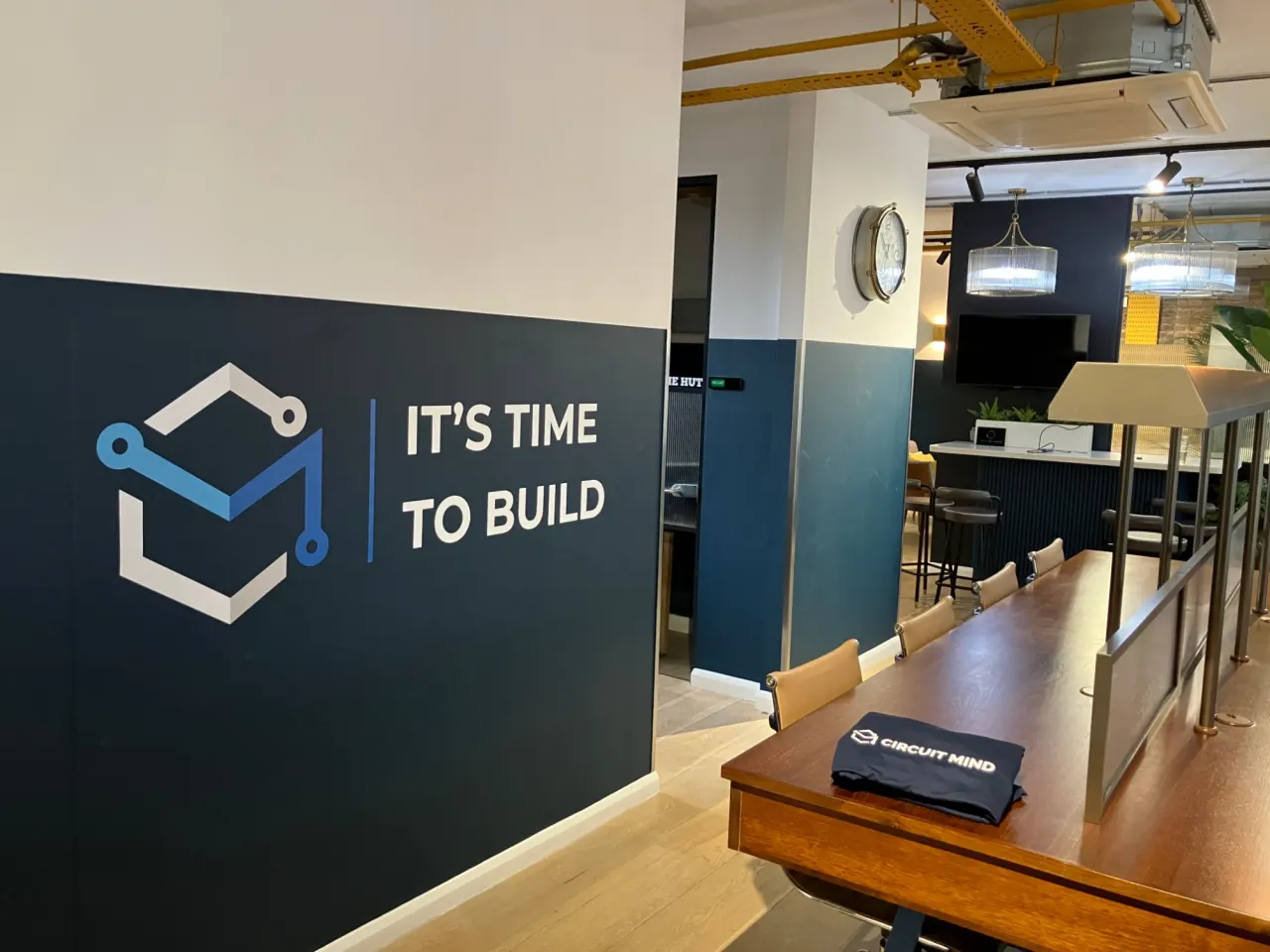 The Circuit Mind office, with “It’s time to build” on the wall
